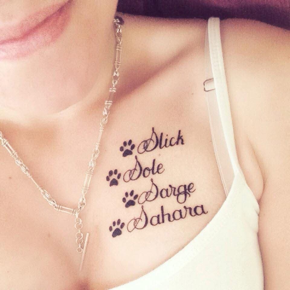 Sophie's tattoo of four paw prints with the names Slick, Sole, Sarge and Sahara